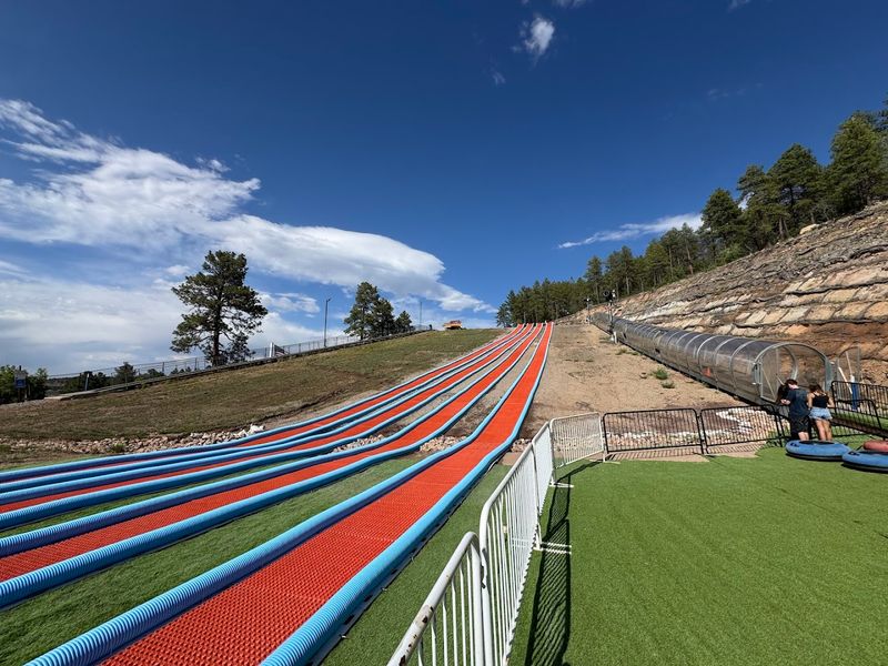 Summer Mountain Tubing On Artificial Turf Slopes
