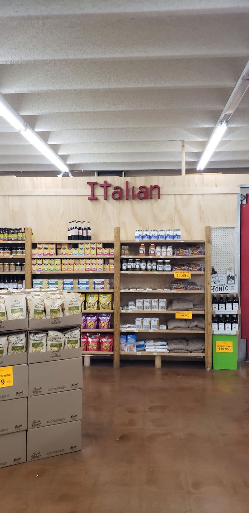 Pantry Aisles Stocked With Nuts, Beans, Spices, And Salsa