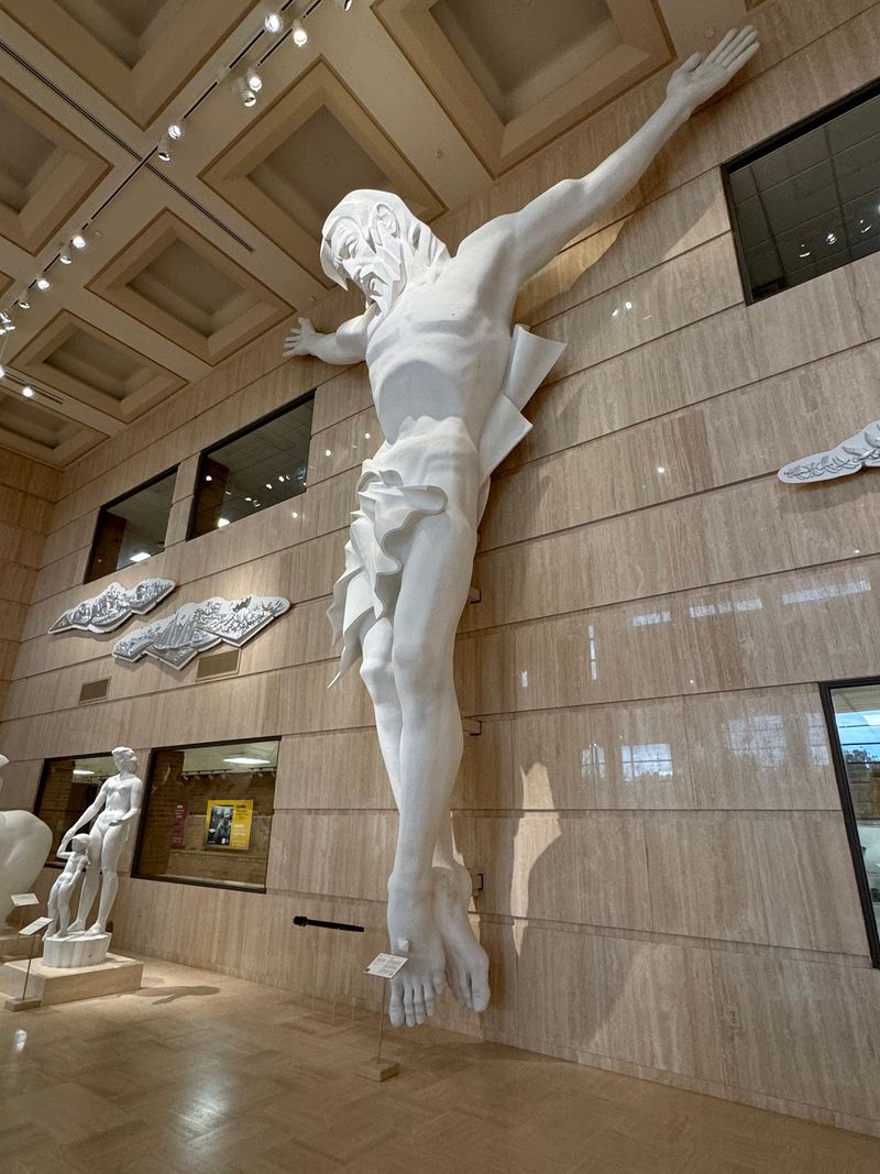Pause Beneath The Towering Christ