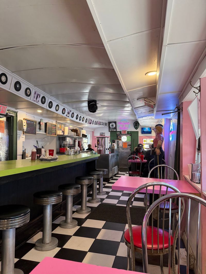 Pink Tables And Spinning Records Set The Mood Fast