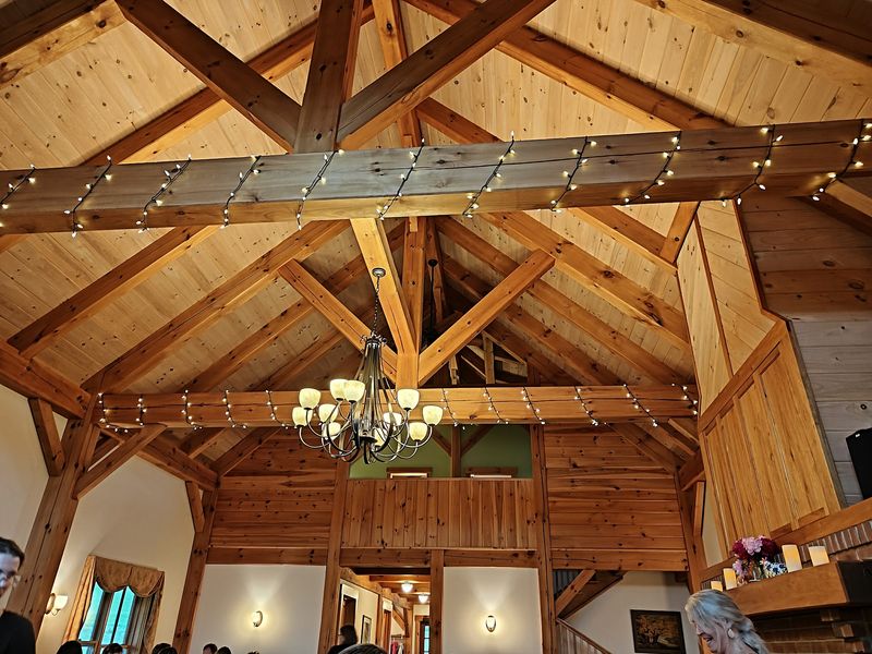 Post And Beam Coziness With A Crackling Hearth