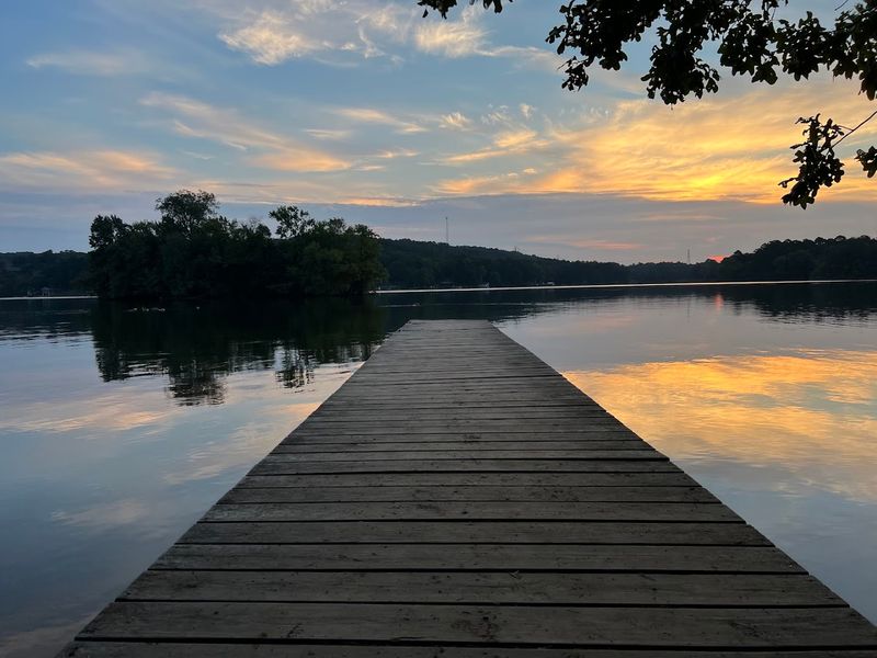 Sunrise Reflections And Evening Campfires By The Lake