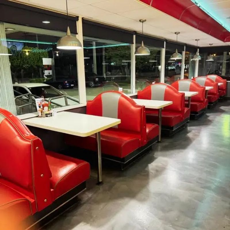 Red Booths And Chrome Make Every Meal Feel Like 1955