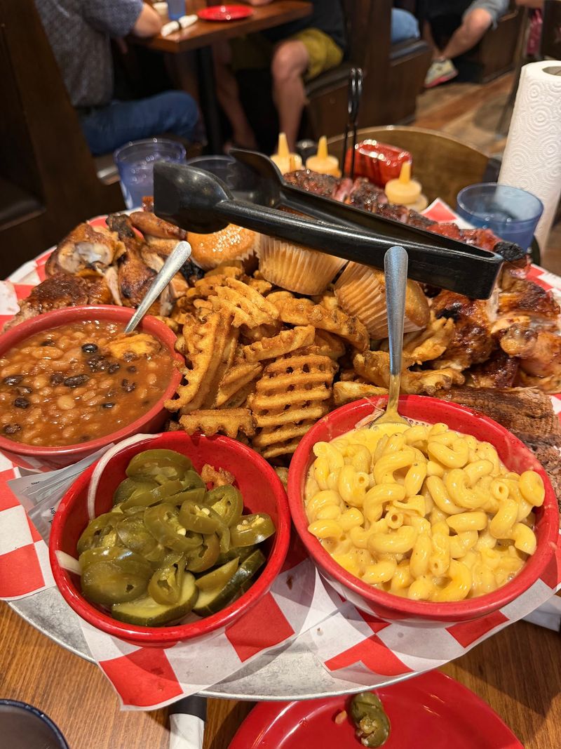 Ribs, Pork, Sausage, And Sides Keep The Table Busy