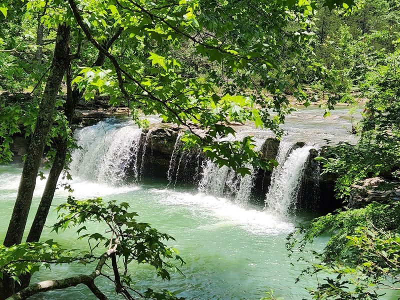 Wide Rock Shelf Pouring Into A Clear Basin