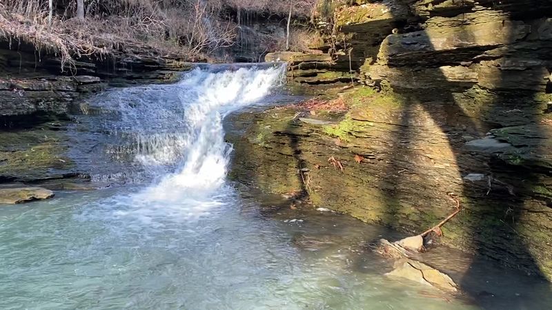 Rocky Ledges Framing A Hidden Waterfall