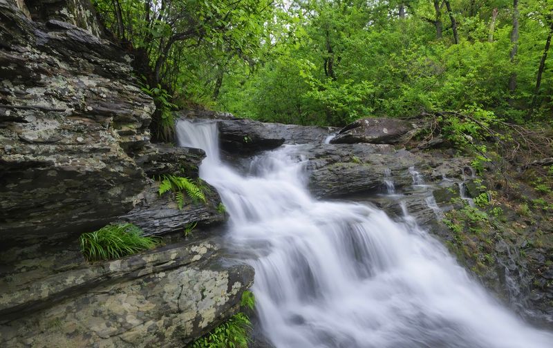 Rocky Ledges With A Soft Waterfall View Rocky Ledges With A Soft Waterfall View