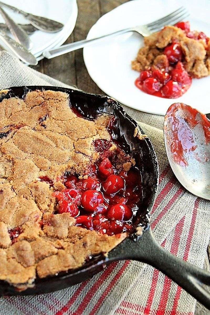 Cherry Cobbler Bubbling In Individual Cast Iron