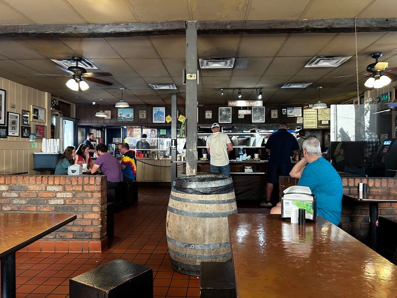 Rustic Tables, Wooden Stools, and a Homey Dive Feel