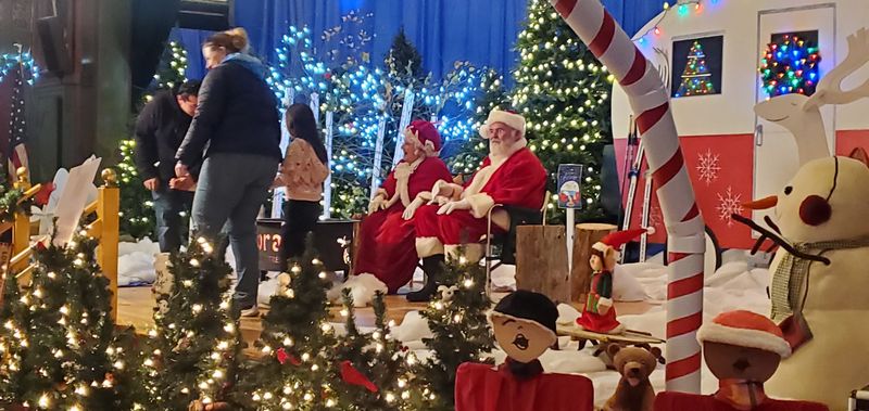 Santa, Mrs. Claus, And One Very Green Guest