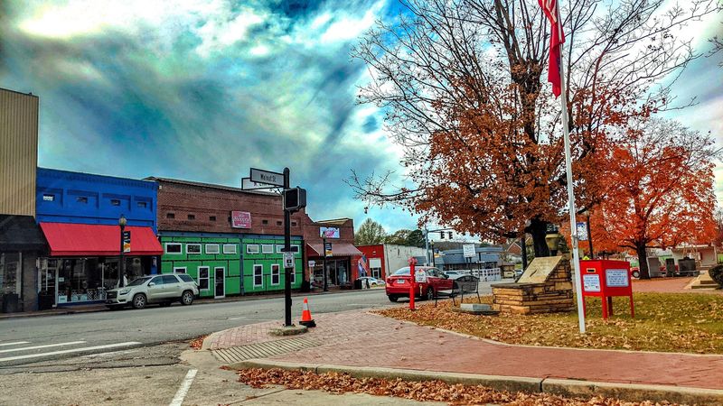 Winding Backroads Through Forested Hills And Open Fields