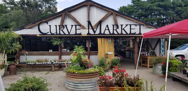 Seasonal Blooms Beside Rustic Market Shelves
