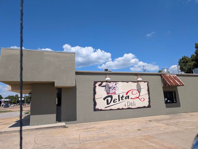 Smoke Trails Behind A Delta Storefront
