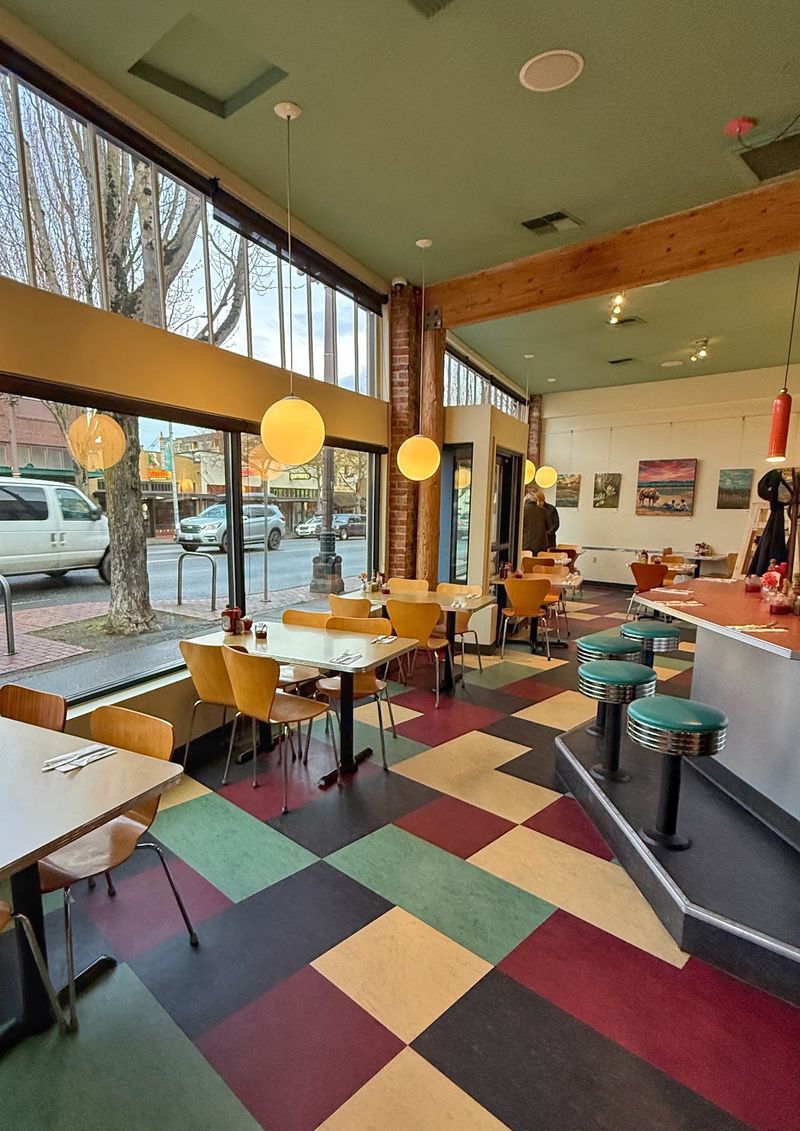Soft Booths, A Classic Counter, And A Lively Hum