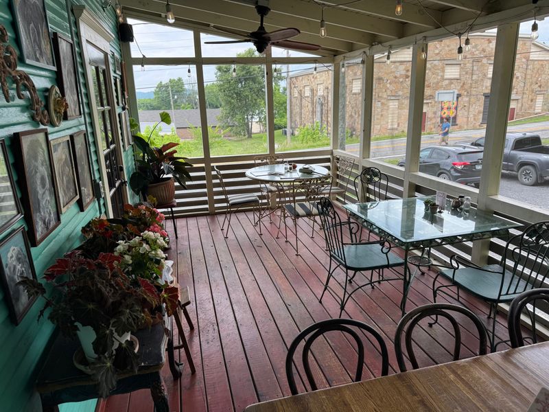 Multiple Charming Seating Areas Including Porches