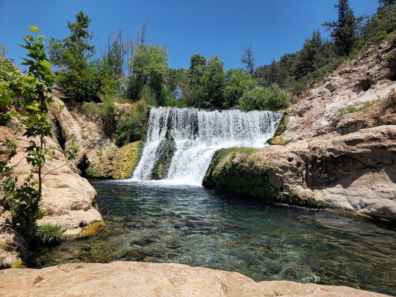 Spreading A Blanket Beside The Falls