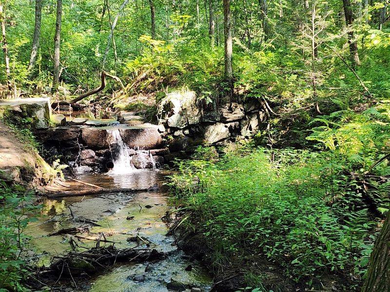 A Waterfall Hidden Along The River Run Trail