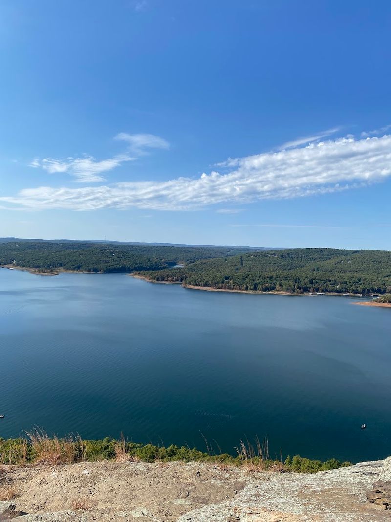 Sunlit Views Across The Mountain Lake