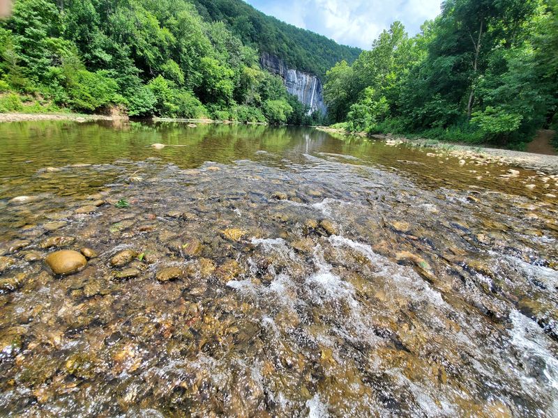 Swim Beneath A 200-Foot Rock Wall
