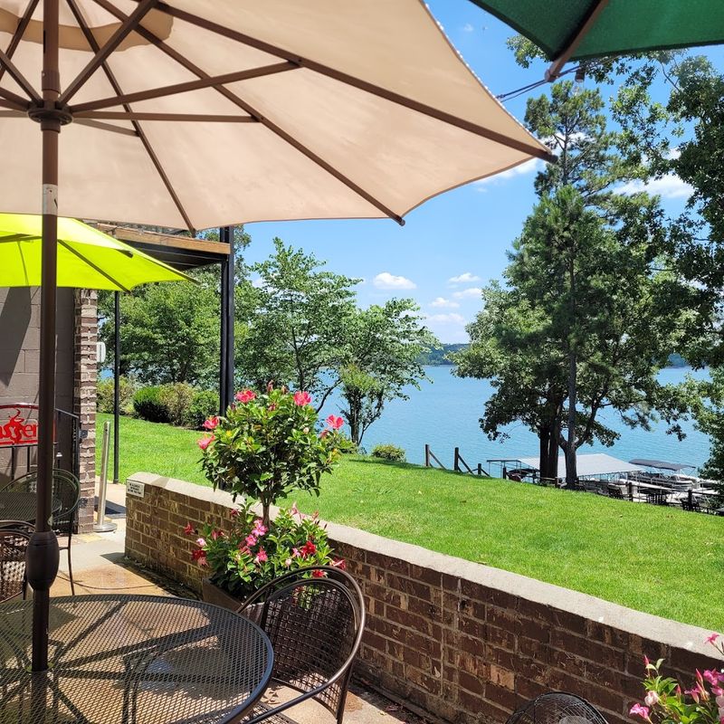 Dining Above Shimmering Water And Forested Horizons