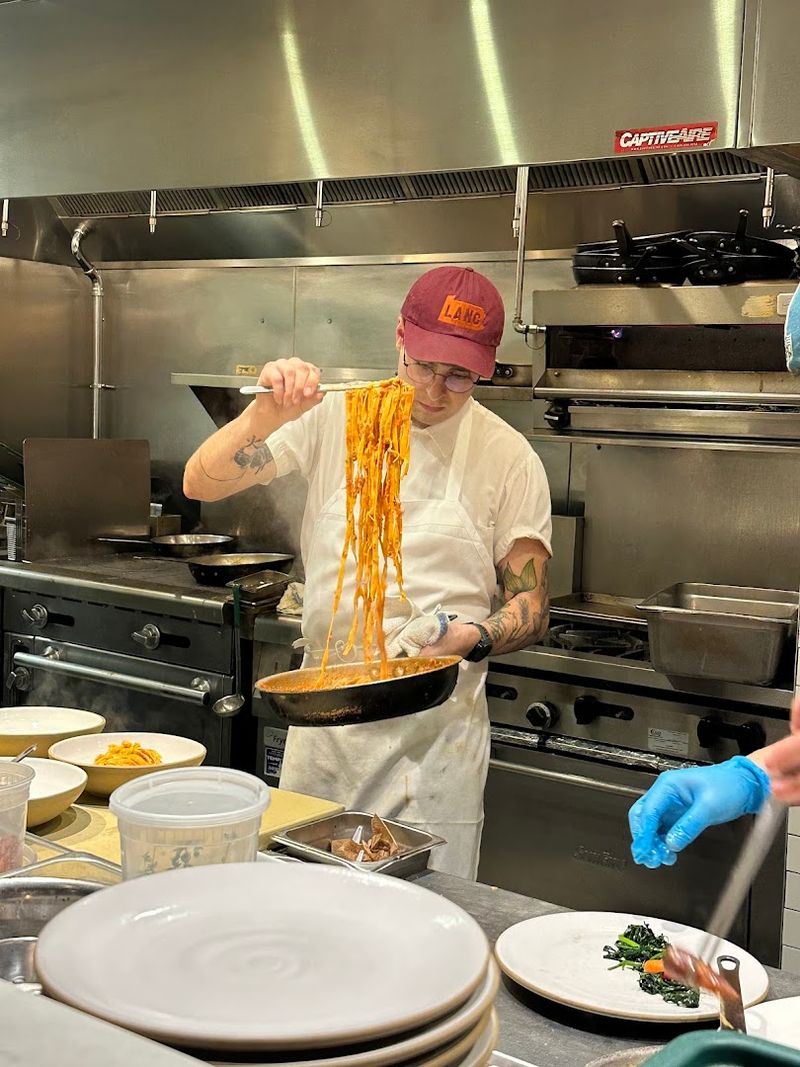 The Anthony Bourdain Photo Above the Kitchen Hood