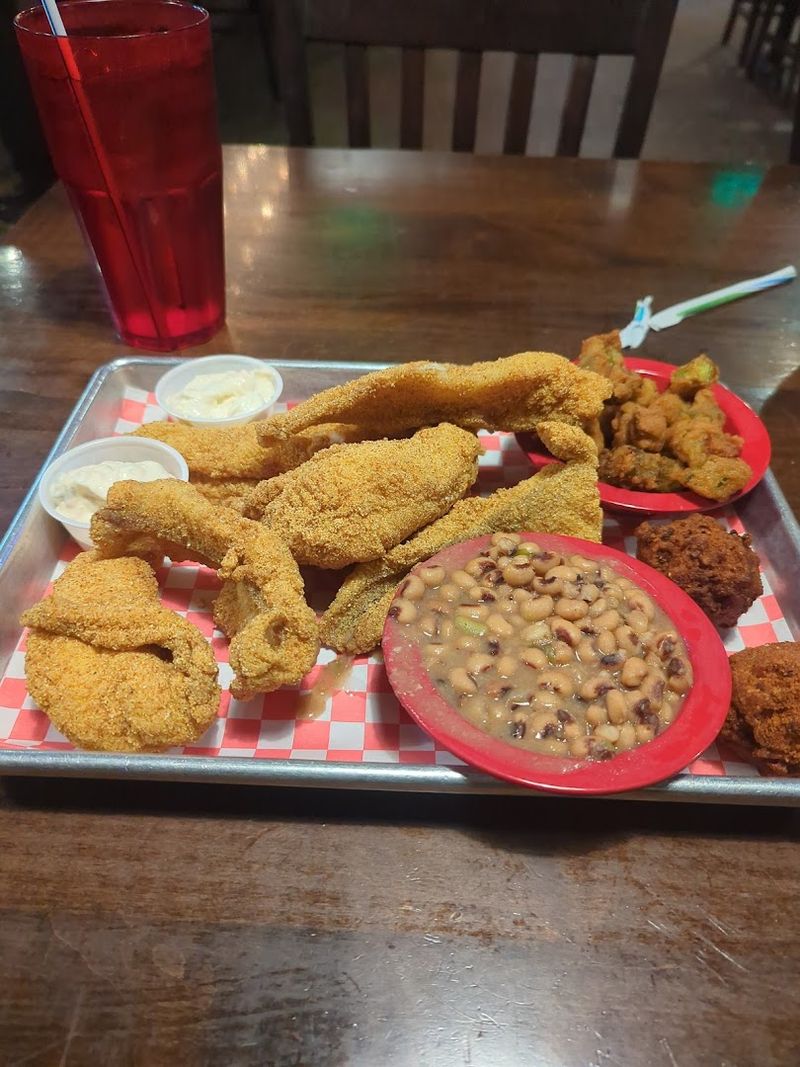 Catfish That Holds Its Own Beside The Pit