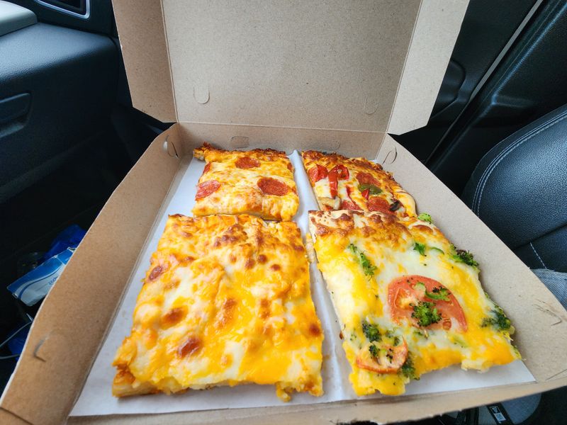 They Even Serve Pizza by the Slice