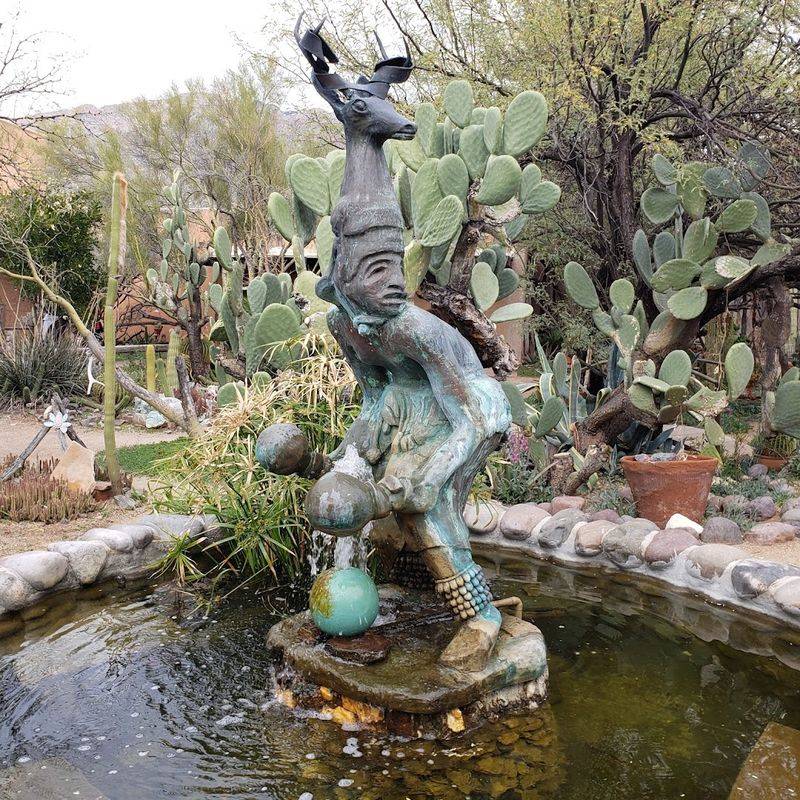 The Courtyard, Sculptures, And A Gate From Another Time