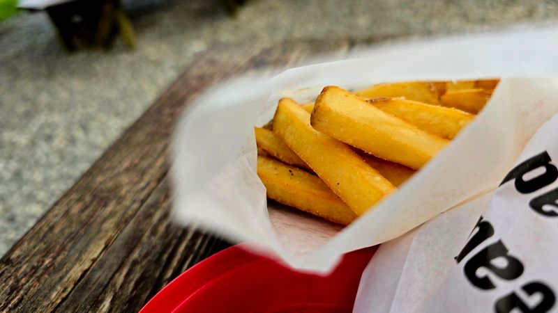 The Fries And Onion Rings Deserve Their Own Spotlight