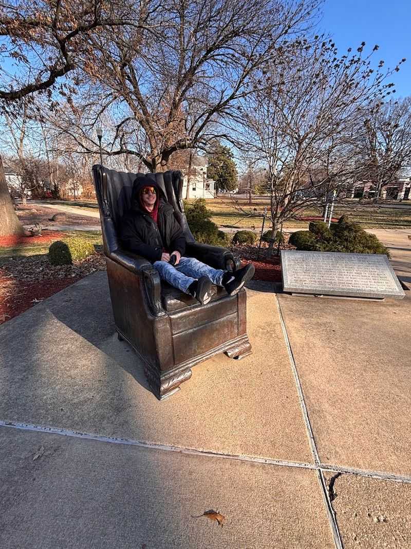 The Giant Chair Beside Him