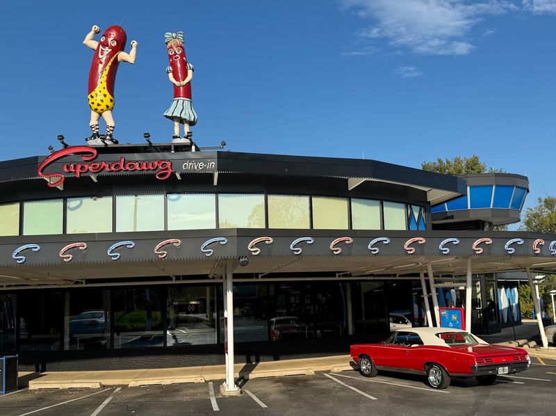 The Giant Hot Dog Couple On The Roof