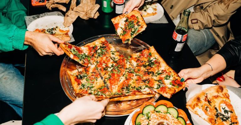 The Hole-In-The-Wall New York Pizza Place Where Every Slice Still Tastes Like Friday Night