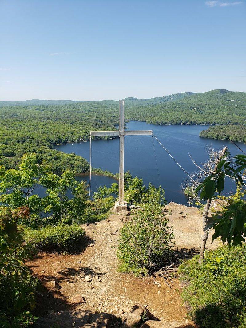 The Iconic White Cross At The Summit