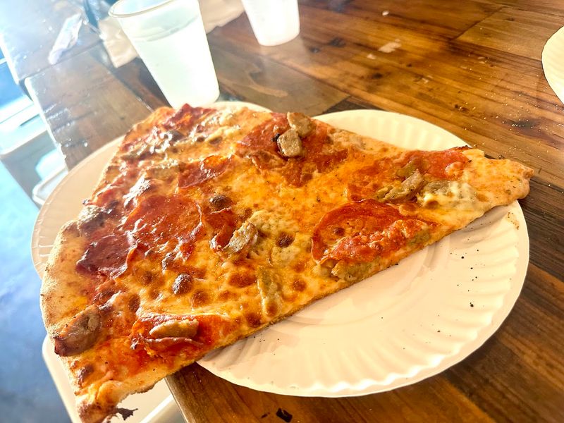 The Legendary Slice Size That Takes Two Paper Plates