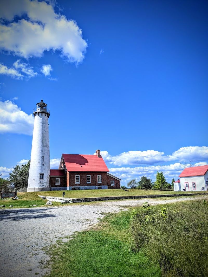 The Lighthouse Waits At The End Of The Sandspit The Lighthouse Waits At The End Of The Sandspit