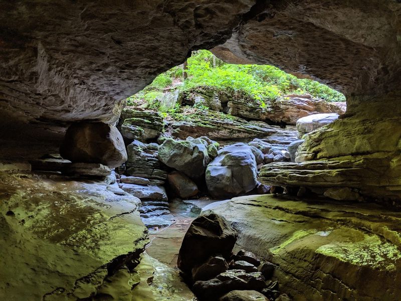 A Narrow Opening Beneath The Rock Walls