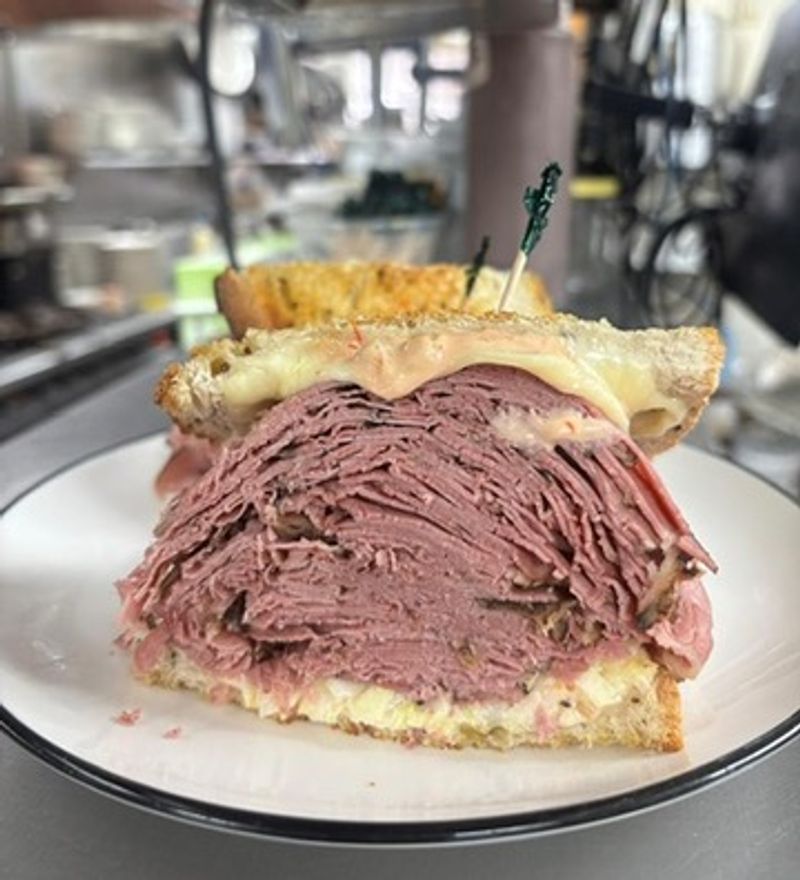 The Corned Beef Is Stacked Generously And Sliced To Perfection