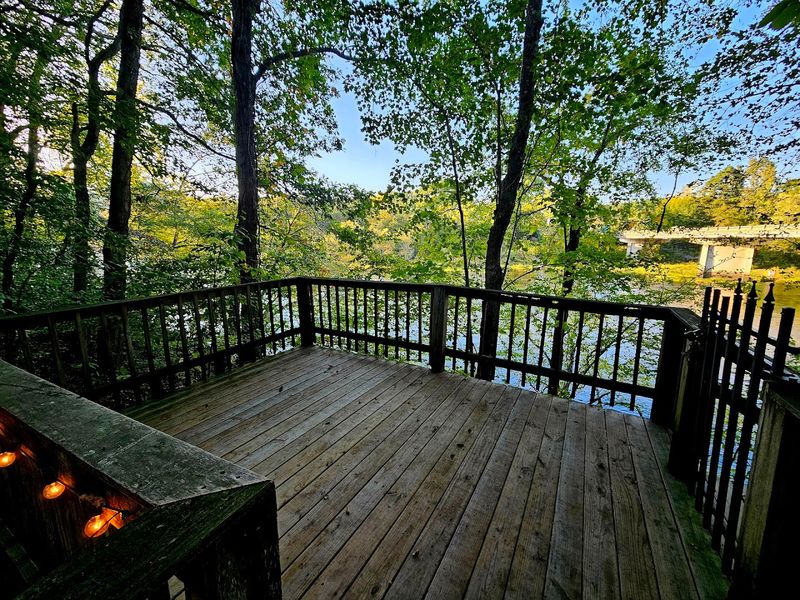 Gravel Turnoff Leads To A Weathered Wooden Porch