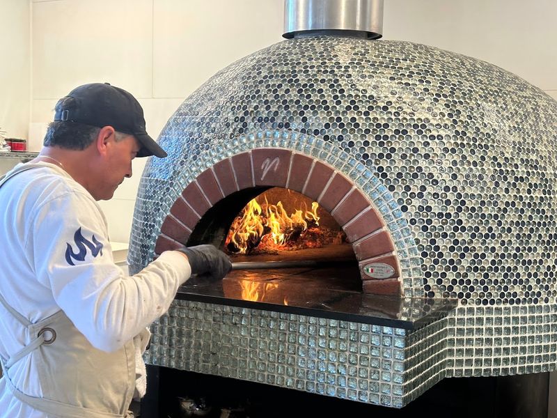 The Pizzaiolo Behind The Magic Oven The Pizzaiolo Behind The Magic Oven