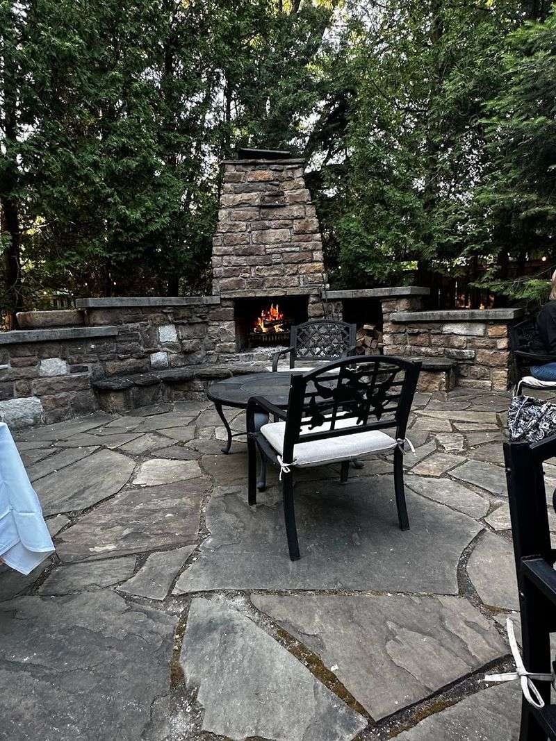 The Fireplace Tables And Glass-Enclosed Rooms Create Unforgettable Ambiance