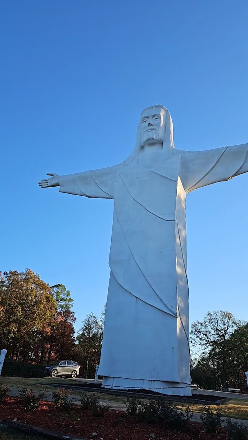 The Statue's Serene Mountain Setting