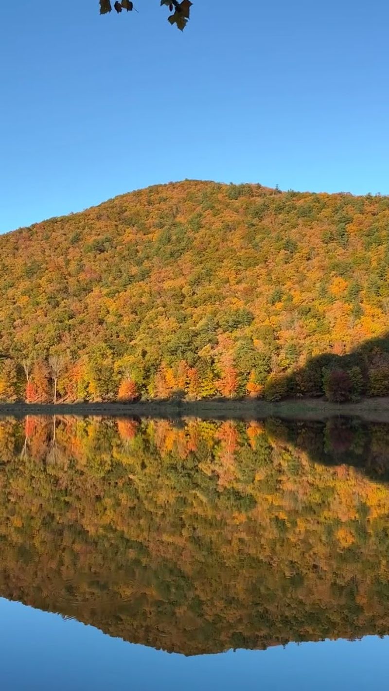 Fall Foliage Reflections On The Lake Are Stunning