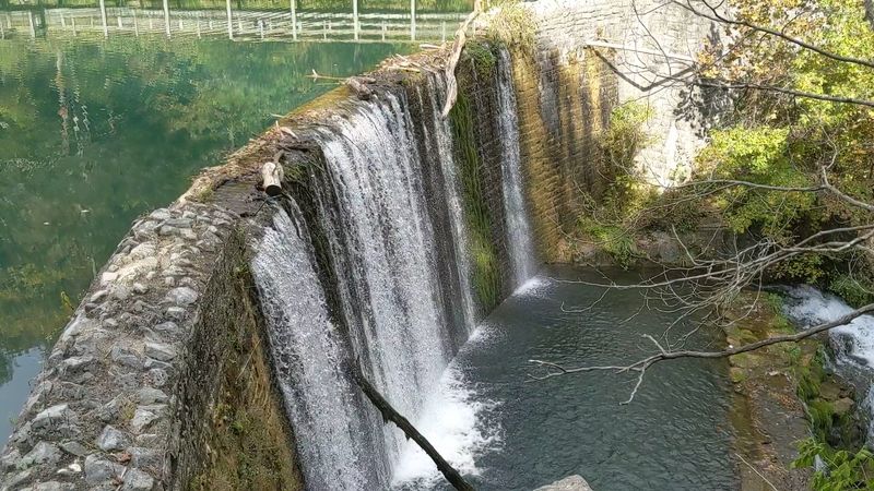 The Historic Stone Dam That Creates The Lake And Waterfall