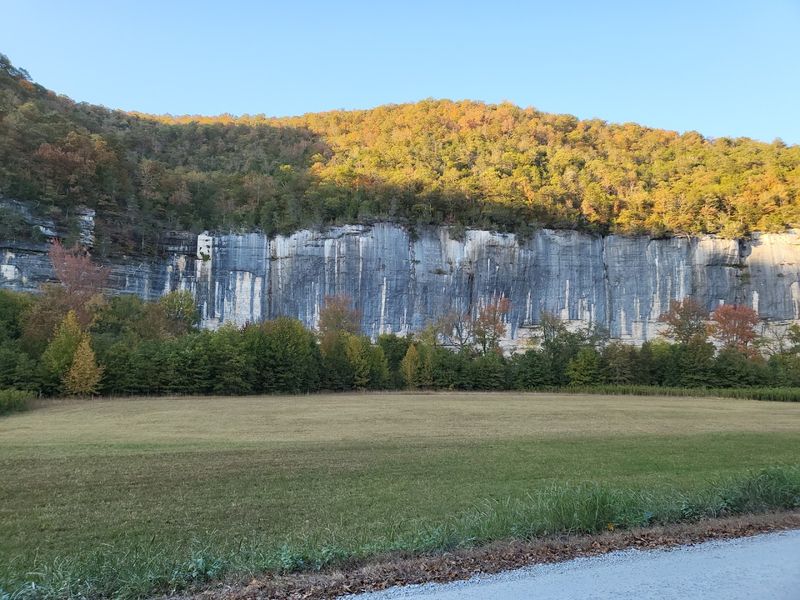 A Campsite Framed By Towering Stone Walls