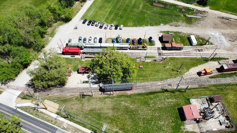 The museum grounds display a depot, caboose, and outdoor equipment The museum grounds display a depot, caboose, and outdoor equipment