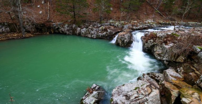 This Arkansas Oasis Hides A Wild Swim Beneath Towering Rock Bluffs