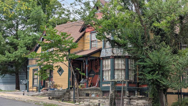Hillside Tracks Glide Past Gingerbread Facades