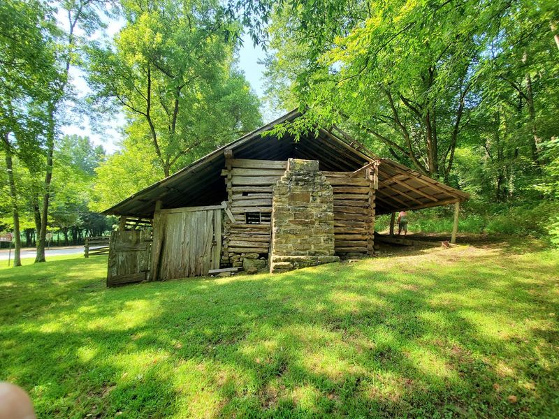 Early Homesteads With Timber Cabins And Stone Foundations