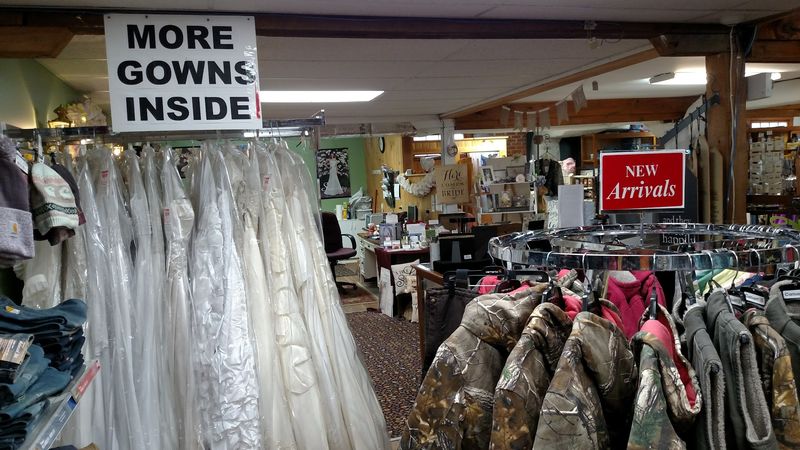 Wedding Gowns Next To Work Boots