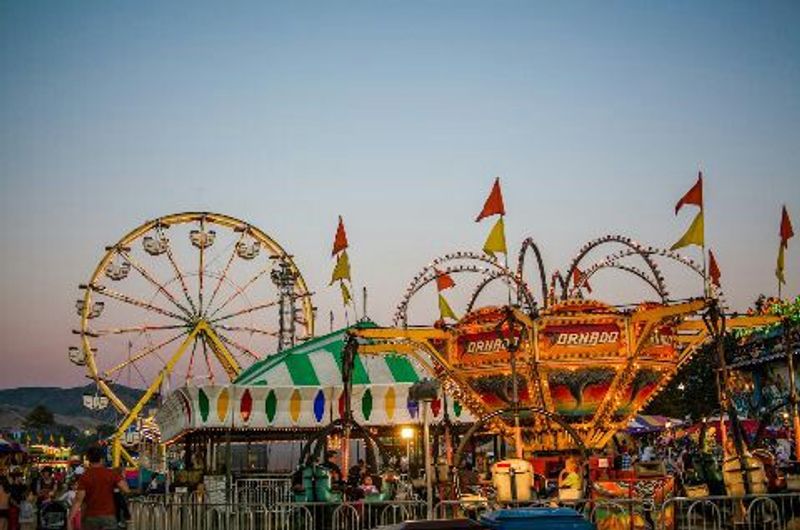 Towering Rides Rise High Above The Fairgrounds